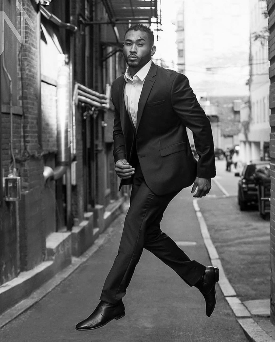 Charles Jourdan walking in a suit